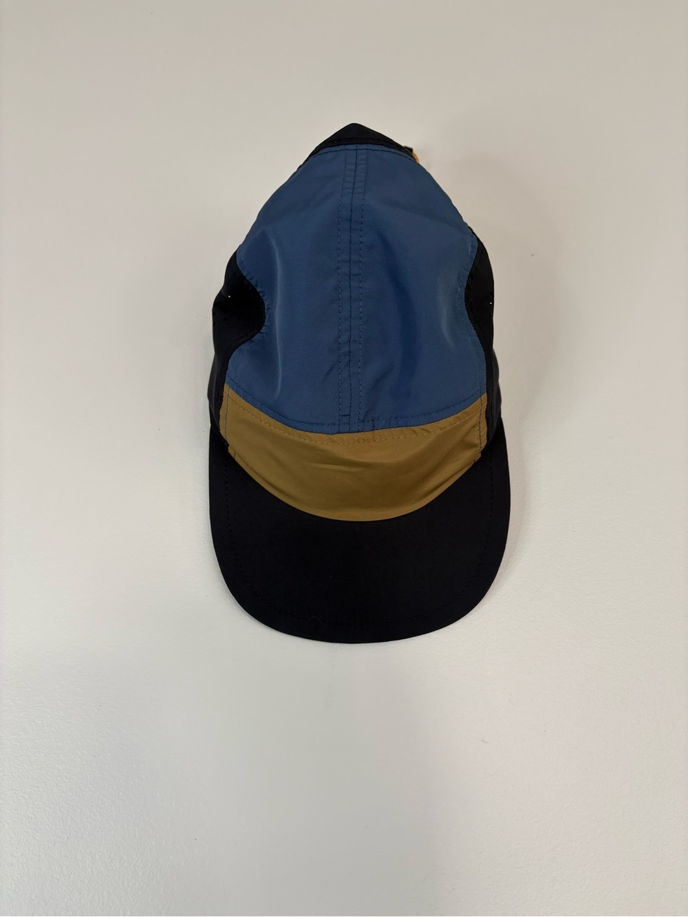 Peak Performance Three-Tone Outdoor Cap in Blue, Mustard, and Navy